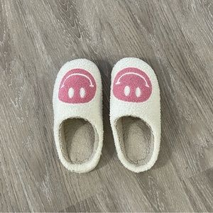 Pink smiley face slippers